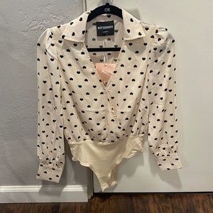 Casual/dressy blouse. Size: extra small. Color: tan/blush with black hearts.